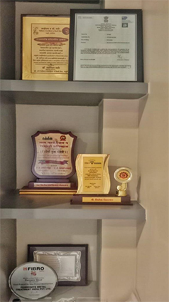Award plaques displayed on wall